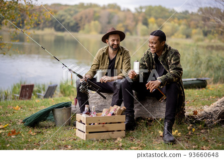 Men with alcohol on fishing outdoors 93660648