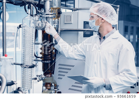 medicine factory scientist worker with Cannabis CBD oil extraction machine. Hemp oil extraction Thin Film Distillation Laboratory Plants Process. 93661659