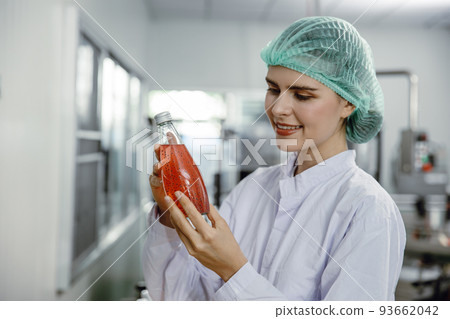 Quality control and food safety inspector test and check product contaminate standard in the food and drink factory production line with hygiene care. 93662042