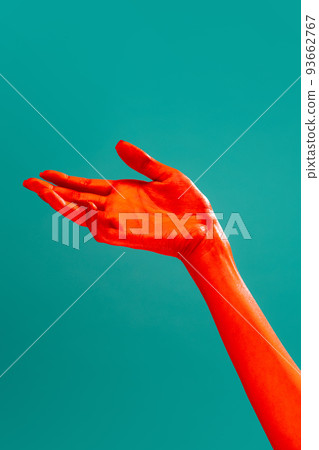 Authentic hands gesturing isolated on cyan color background in red neon light. Concept of relationship, community, care, support, symbolism, culture 93662767