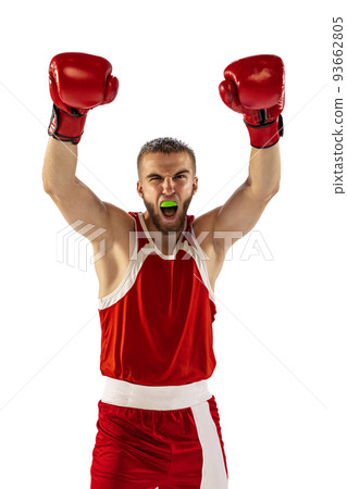 Winner emotions. Male boxer in red uniform and boxing gloves training isolated on white background. Strength, attack and motion, betting concept. 93662805