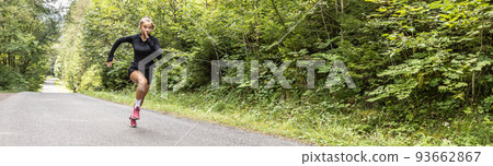 Banner of a female sprinter running throught the forest in the summer Banner of a female sprinter running throught the forest in the summer 93662867