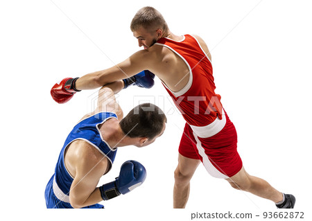 Sportive men, two professional boxer in sports uniform practicing punch isolated on white background. Concept of sport, competition, training, energy Sportive men, two professional boxer in sports uniform practicing punch isolated on white background. Concept of sport, competition, training, energy 93662872
