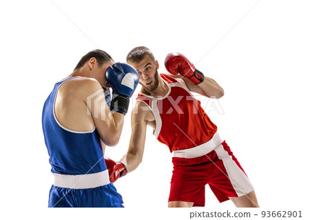 Sportive men, two professional boxer in sports uniform practicing punch isolated on white background. Concept of sport, competition, training, energy 93662901
