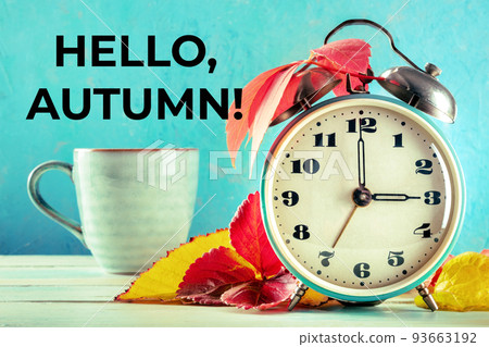 Hello, Autumn Greeting card with a retro alarm clock and a cup of coffee 93663192