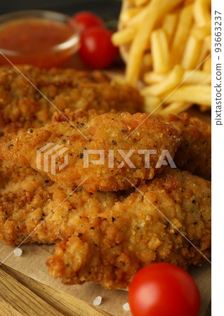 Concept of tasty food with Chicken strips, close up Concept of tasty food with Chicken strips, close up 93663237