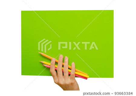 An empty colored poster in his hand and pencils. Isolated on a white background. Copy space 93663384