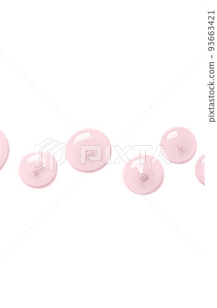 Pink drops of gel closeup. Cosmetic product for moisturizing the skin of the face or body. Copy space. 93663421
