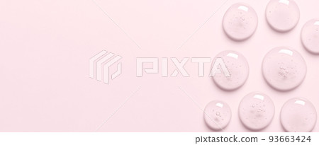 Pink drops of gel closeup. Cosmetic product for moisturizing the skin of the face or body. 93663424