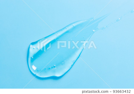A drop of liquid gel or cosmetic serum or cleansing lotion against acne. Blue background. 93663432