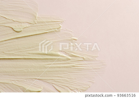 A sample of moisturizer on a pink background. Cosmetic product for the skin. Copy space 93663516
