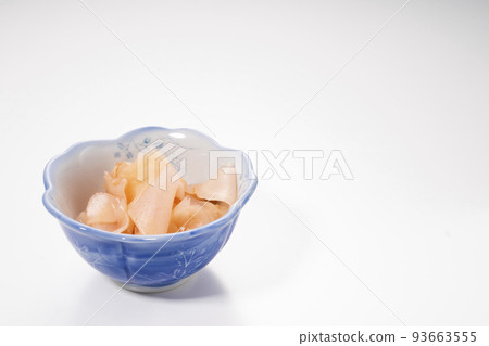 Sweet and sour pickled ginger in a small bowl with a white background 93663555