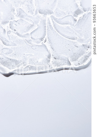 Transparent cosmetic texture. Skin serum or washing gel. Macrophotography. Copy space. 93663653
