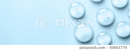 Blue drops of gel close-up. Cosmetic product for moisturizing the skin of the face or body. Copy space Blue drops of gel close-up. Cosmetic product for moisturizing the skin of the face or body. Copy space 93663779