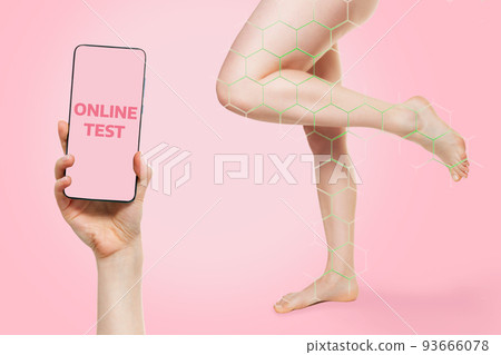 Beautiful healthy legs of a woman with a green zone for determining the disease. Smartphone for online health test. Mock up. Pink background. The concept of varicose veins and modern treatment 93666078