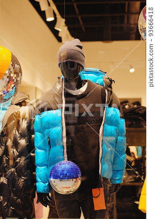 Mannequins in the big shopping shop. Mannequins in casual clothes stand in a clothing store. 93666418