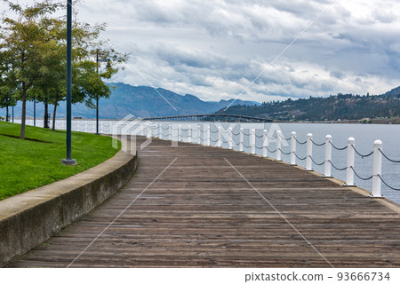 Wooden boardwalk along the waterfront on Okanagan lake in British Columbia 93666734