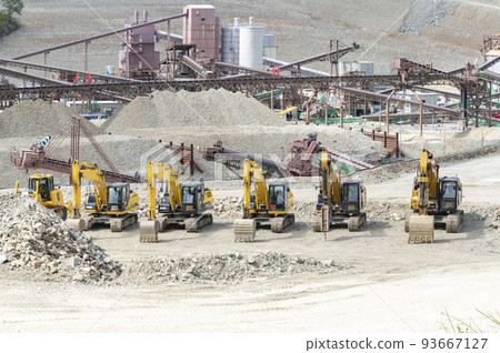 Heavy machinery lined up at the construction site Heavy machinery lined up at the construction site 93667127