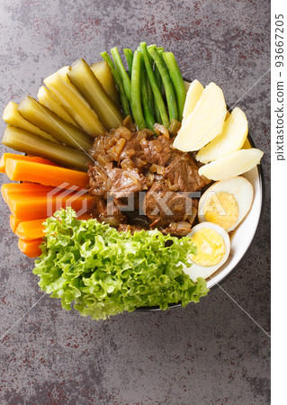 Selat Solo or Javanese Bistik east javanese traditional food indonesian culinary Closeup in the bowl. Vertical top view Selat Solo or Javanese Bistik east javanese traditional food indonesian culinary Closeup in the bowl. Vertical top view 93667205