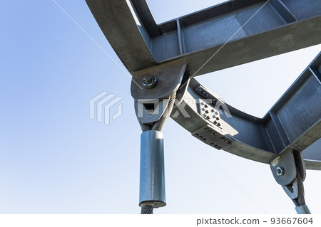 Massive industrial steel construction with bolts connecting steel beams, and metal rope Massive industrial steel construction with bolts connecting steel beams, and metal rope 93667604