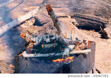 Flame from burning logs in fireplace. Wood fire prepared for grill on nature. Brazier with burning firewood. Picnic. Flame from burning logs in fireplace. Wood fire prepared for grill on nature. Brazier with burning firewood. Picnic. 93667763