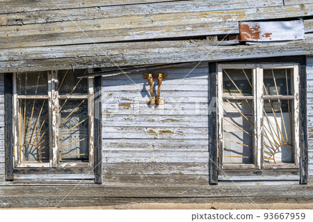 Old wooden windows with metal grid 93667959