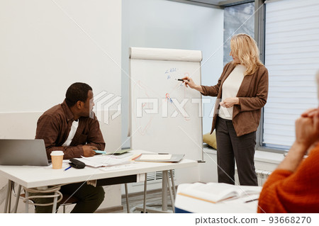 Woman presenting her report at lesson 93668270