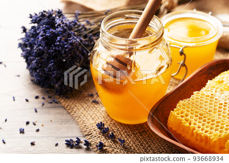 Honeycomb in clay dish on kitchen table sweet background 93668934