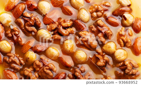 Honeyed assorted nuts organic food background flat view 93668952