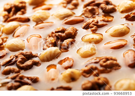 Honeyed assorted nuts organic food background 93668953