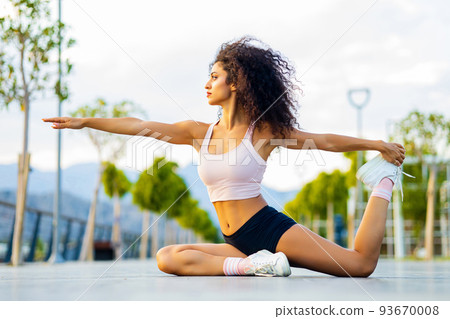 spanish brazil relaxing her leg and hand muscles in outdoor sport area 93670008