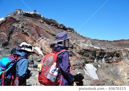 Mountain girl looking at the crater of Mt.Fuji with Kengamine in the background 93670315
