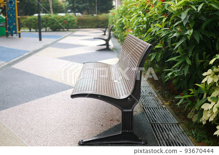 a empty bench at garden park 93670444