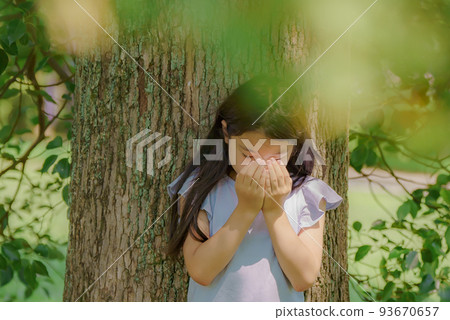 girl hiding her downcast face 93670657