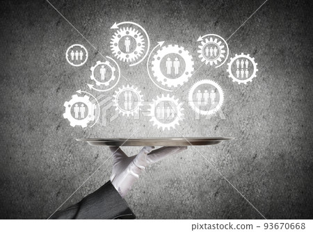 Waiter hand with white gloves holding silver plate full of social media communication icons Waiter hand with white gloves holding silver plate full of social media communication icons 93670668