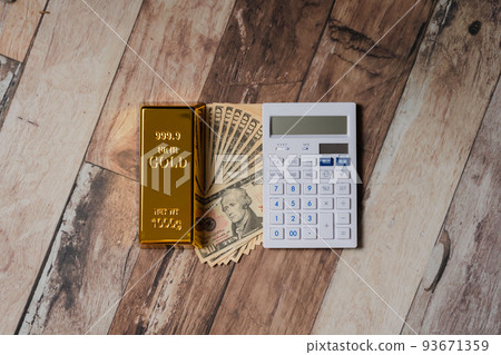 Gold ingot Gold and dollar bills Calculator 93671359