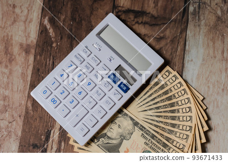 US dollar banknotes and calculator 93671433