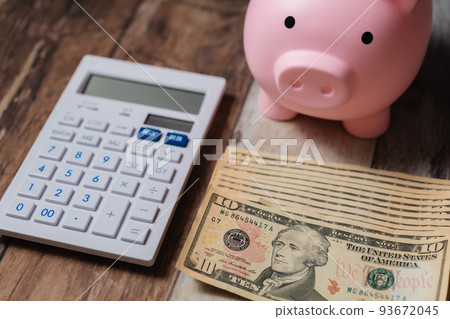 US dollar banknotes and calculator 93672045