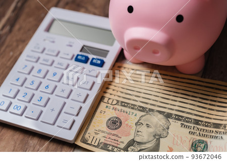 US dollar banknotes and calculator 93672046