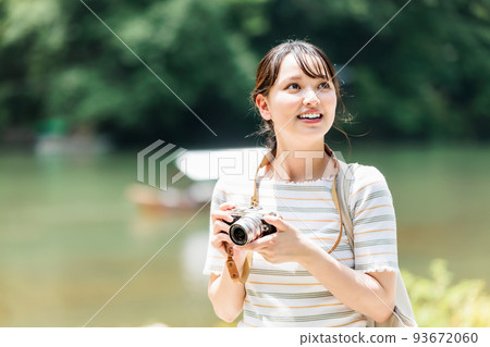 A young woman enjoying sightseeing A young woman enjoying sightseeing 93672060