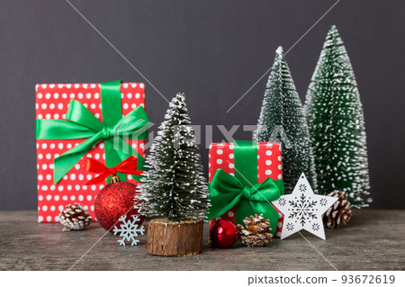 Christmas composition. craft Gift box, small tree, branches and craft DIY decorations on white background. New year concept. Christmas home decoration Flat lay, top view, copy space 93672619