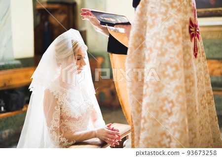 Beautiful bride get married in a church Beautiful bride get married in a church 93673258