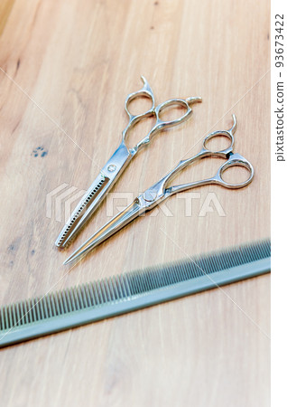 Hairdresser's scissors and comb, scissors and comb 93673422