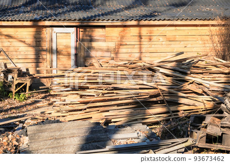 Big stack of tree trunks at wood production lumber mill. Processing timber material at wood construction warehouse. Chopped firewood stumps. Forestry. Big stack of tree trunks at wood production lumber mill. Processing timber material at wood construction warehouse. Chopped firewood stumps. Forestry. 93673462