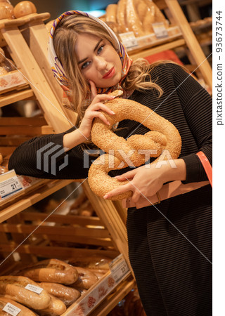 Pretty woman in the bread depatment 93673744