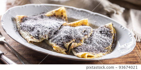 Traditional Slovak and Czech potato dumplings with popy seeds and sugar. 93674021