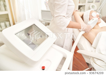 Laser hair removal treatment. Clinic skin care procedure. Medical dermatology 93674209