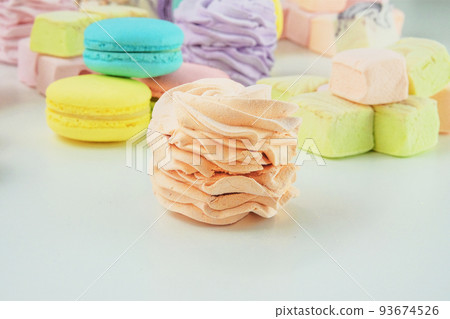 Marshmallows, macaroons, and zephyrs. Traditional colored sweet desserts for the holiday, copy space. 93674526