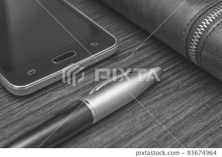 Men's accessories with wallet, pen, smartphone black and white photo Men's accessories with wallet, pen, smartphone black and white photo 93674964