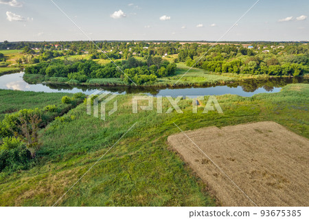 Drone view over summer sunset river Ros landscape, Ukraine. 93675385